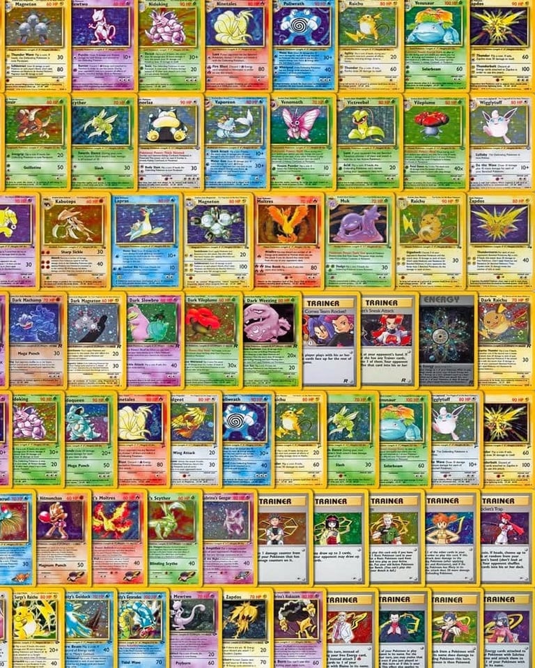 Collection of Pokemon trading cards arranged in a grid layout, featuring various creatures and trainer cards with colorful borders and holographic designs